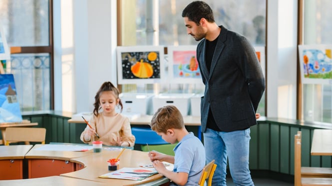 Early childhood educator observing a child's play.